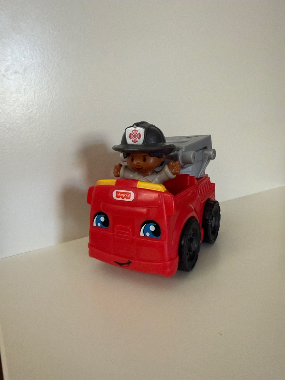 Fisher-Price Red Plastic Fire Engine with Firefighter Figure and Ladder